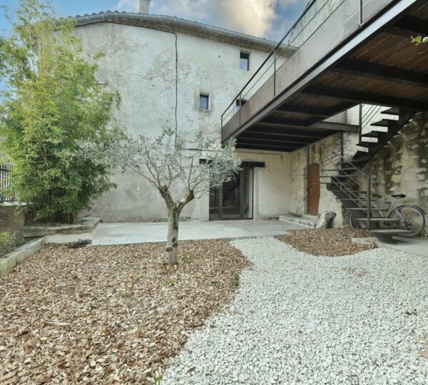 The charm of a stone village house with garden and terraces 20 minutes from Uzes!